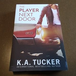 The Player Next Door by K. A. Tucker